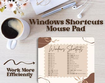 May include: A beige mouse mat featuring Windows shortcuts, with the text "Work More Efficiently." The mat has a brown decorative design. A coffee cup, glasses, pen, and earphones are also on the desk.