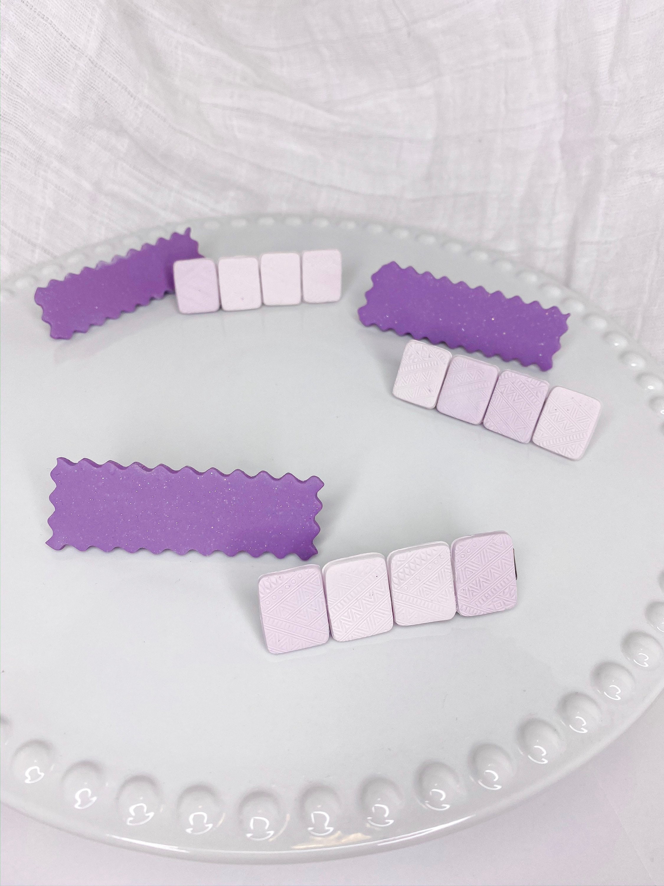 A  Twin Pack Of Large Purple Hair Clips 