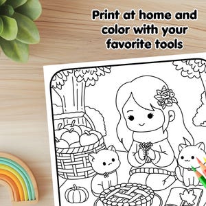 May include: A black and white coloring page featuring a girl with long hair, a basket of apples, a pie, and two cats. The text "Print at home and color with your favorite tools" is at the top of the page.