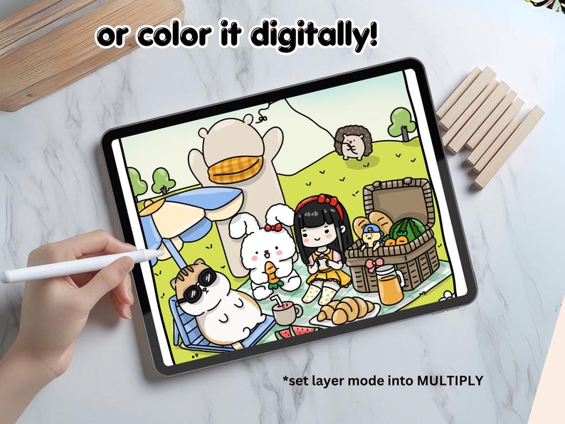 May include: A digital illustration of a picnic scene with a bear, a rabbit, a cat, and a girl. The characters are sitting on a blanket with a picnic basket, food, and a parasol. The text "or color it digitally!" is at the top of the image. The text "*set layer mode into MULTIPLY" is at the bottom of the image.