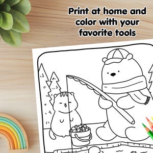 May include: A black and white coloring page featuring a bear wearing a hat and scarf, holding a fishing rod. A smaller animal, possibly a cat, is standing next to the bear, holding a bucket of fish. The text "Print at home and color with your favorite tools" is at the top of the page.