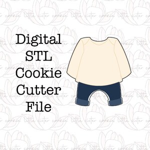 May include: Digital STL cookie cutter file for a long-sleeved shirt and trousers outfit. The shirt is cream coloured and the trousers are blue.
