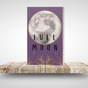 May include: A purple book with a gold outline of a full moon and the text "FULL MOON" on the front cover.
