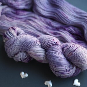 tweed yarn,
hand dyed yarn,
gradient yarn,
sock yarn,
nylon blend yarn,
gothic yarn,
purple wool yarn,
gifts for knitters,
juicy purple yarn,
yarn cozy,
yarn lover gift,
natural dyed yarn,
pastel yarn,