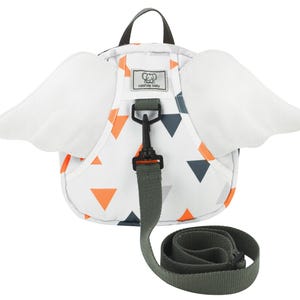 May include: White toddler backpack with orange and gray geometric pattern and attached wings. The backpack has a leash with a clip.