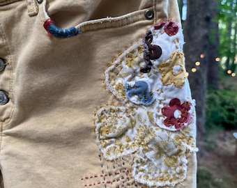 Embroidered & patched soft yellow cutoff jean shorts, Upcycled boho size med shorts, 70's "flower power" style w/ beautiful slow stitching,