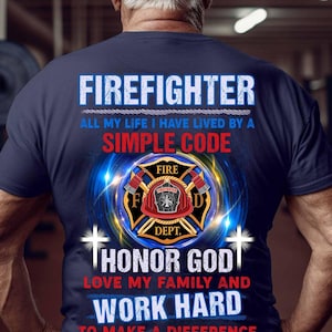 May include: A navy blue t-shirt with a firefighter emblem and the text "FIREFIGHTER ALL MY LIFE I HAVE LIVED BY A SIMPLE CODE HONOR GOD LOVE MY FAMILY AND WORK HARD TO MAKE A DIFFERENCE".