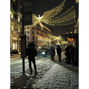 Christmas snowfall in Piccadily Circus, London, UK
