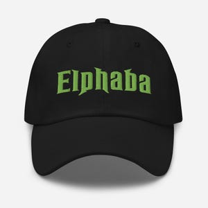 May include: A black baseball cap featuring the word Elphaba embroidered in a bright lime green font across the front panel. The cap has a structured crown, a curved brim, and a button at the top centre, showcasing a clean and simple design.