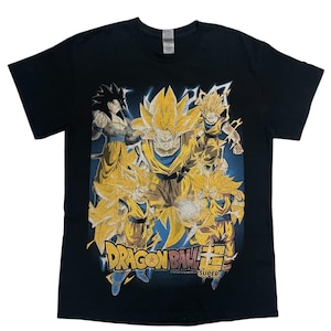 May include: Black t-shirt with a graphic print of characters from Dragon Ball Super. The design features multiple figures in yellow and gold hues against a blue backdrop, with the Dragon Ball Super logo visible.