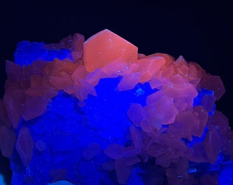 Large fluorescent Calcite Crystals with light green cubic fluorite