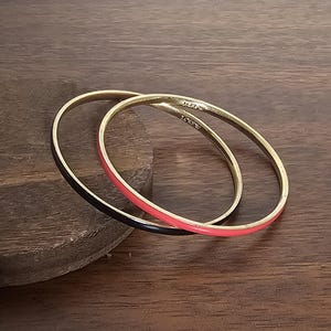 Pair of J Crew Black and Dark Coral Pink Enamel Bangle Bracelets