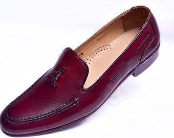 Handgemaakte leren penny-loafers: gepatineerde schoenen