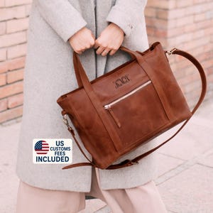 Ledertasche für das ipad mit einem großen Innenfach, in das leicht ein Laptop oder Ipad sowie ein Ordner mit Dokumenten passen.