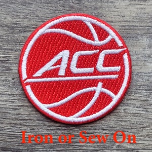 May include: Red and white embroidered iron-on or sew-on patch featuring a basketball with the letters "ACC" in white.