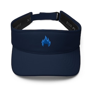May include: Navy blue visor with a blue flame logo embroidered on the front. The visor has a curved brim and an adjustable strap. The interior band is black with the text "XFIT" and "110 F" printed on it.