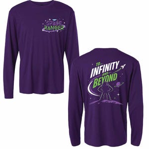 May include: A purple long-sleeve t-shirt featuring a small Space Ranger logo on the front chest. The back displays a graphic of a character standing on a planet with the text To Infinity and Beyond, a rocket ship, and stars in white and green.