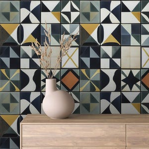 May include: A beige ceramic vase with a rounded body sits on a wooden table in front of a wall covered in black, white, and yellow geometric patterned tiles.