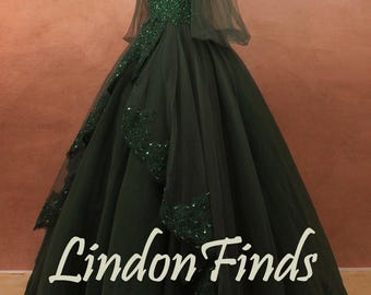 May include: A dark green ball gown with a V-neck bodice embellished with sequins. The dress features sheer sleeves and a full skirt with lace and sequin detailing. The text "Lindon Finds" is visible.