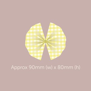 May include: A yellow and white gingham bow, approximately 90mm wide by 80mm high.