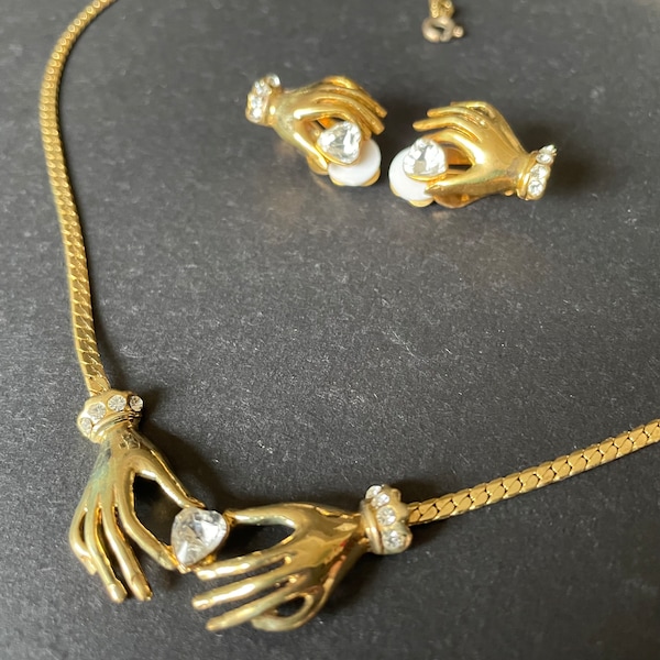 Vintage necklace and clip on earrings set, gorgeous gold tone settings with hand motif and clear heart shaped rhinestones