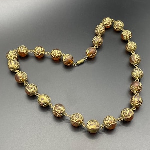 Vintage Art Deco smoky topaz colour moulded glass bead necklace with gold tone enamel / gilt decoration