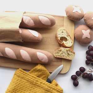 May include: A rustic wooden sign with the text "Welcome to our home" in white lettering. The sign features a distressed finish and a simple, inviting design, perfect for entryway decor.