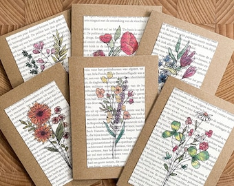 Set of six different floral cards printed on book pages