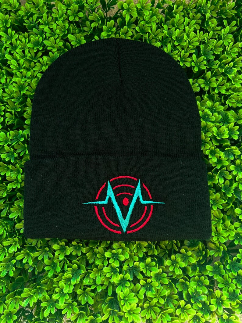 May include: Black beanie with a red and blue embroidered logo featuring a stylized letter V inside a circle with a heartbeat symbol.