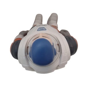 May include: A white and orange Buzz Lightyear action figure, viewed from above. The figure has a blue helmet and gray gloves. The word "LIGHTYEAR" is printed on the figure's chest.