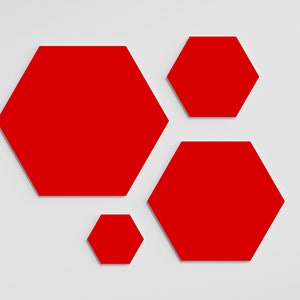 May include: Four red hexagon shapes of varying sizes are arranged on a white background. The shapes are flat and solid, with a clean, modern aesthetic. The arrangement is visually balanced, with the shapes distributed across the frame.