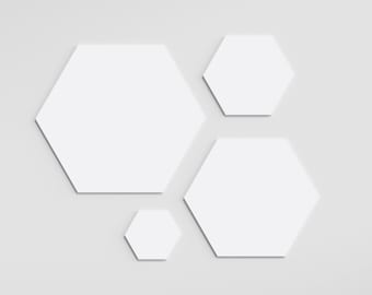 May include: Four white hexagonal shapes of varying sizes are arranged on a white background. The largest hexagon is at the top left, with the other three hexagons arranged below it.