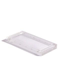 May include: A clear plastic rectangular tray with a raised edge.