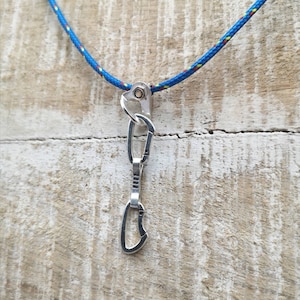Climbing quickdraw pendant.