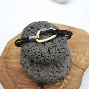 18-karat gold and sterling silver climbing carabiner bracelet. Climbing jewelry