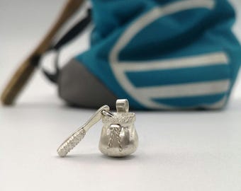 Hanging chalk bag and climbing brush.