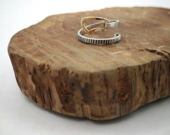 Silver and gold climbing ribbon ring