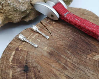 Tricam climbing earrings.