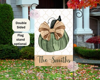 May include: A green pumpkin with a brown bow and the text "The Smiths" on a white background with a decorative pattern.