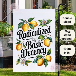 May include: A white garden flag with the text "Radicalized by Basic Decency" in black script, adorned with watercolor lemons and green leaves. The flag is double-sided and measures 12x18 inches.