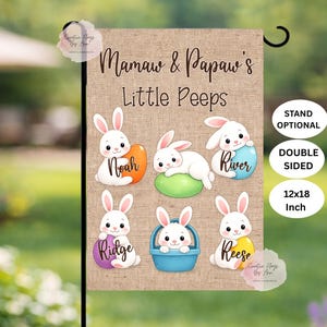 May include: A double-sided 12x18 inch garden flag with the text "Mamaw & Papaw's Little Peeps." It features cartoon bunnies holding Easter eggs and a basket. The flag is optional to be placed on a stand.