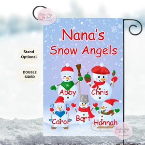 May include: A double-sided garden flag featuring a winter scene with snowmen. The flag reads "Nana's Snow Angels" and includes the names Abby, Chris, Carol, Bart, and Hannah. The flag is designed with a winter theme.