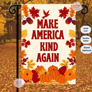 May include: A double-sided garden flag with the text "MAKE AMERICA KIND AGAIN" in burgundy. The flag is decorated with fall leaves, acorns, berries, pumpkins, and a bird. The flag measures 12x18 inches.