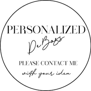 May include: A black and white circular graphic featuring the word "PERSONALIZED" at the top. Below is the cursive text "De Boss" and the text "PLEASE CONTACT ME with your idea" at the bottom. The design is minimalist and stylish.