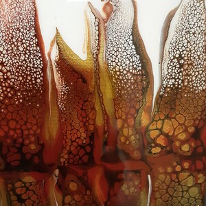 May include: Abstract painting with a white background and brown, gold, and red paint creating a flowing, organic pattern.
