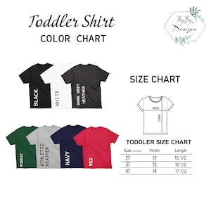 May include: A color chart for toddler shirts in various colors, including black, white, dark grey heather, forest, athletic heather, navy, and red. A size chart is also included, showing sizes 2T, 3T, and 4T with corresponding width and length measurements in inches.