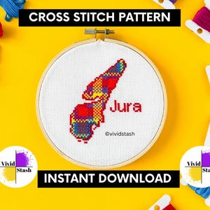May include: A cross stitch pattern in a wooden hoop, featuring a colorful map of Jura with the name in red. The text "CROSS STITCH PATTERN" and "INSTANT DOWNLOAD" are displayed. Colorful embroidery floss surrounds the hoop.