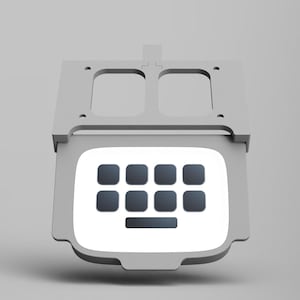 May include: A white, rectangular, plastic keyboard with a gray frame and a gray top. The keyboard has 10 black keys and a long black space bar.