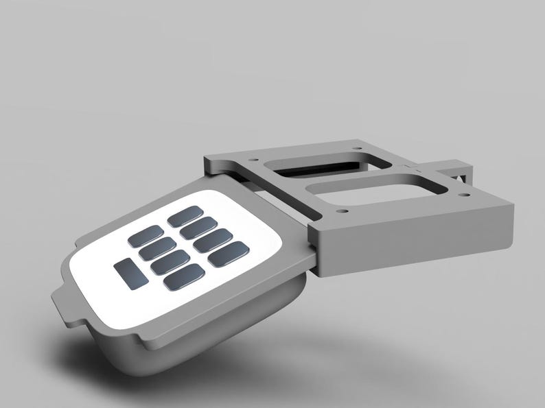 May include: A gray plastic keypad with a white face and 12 buttons. The keypad is attached to a gray plastic frame.
