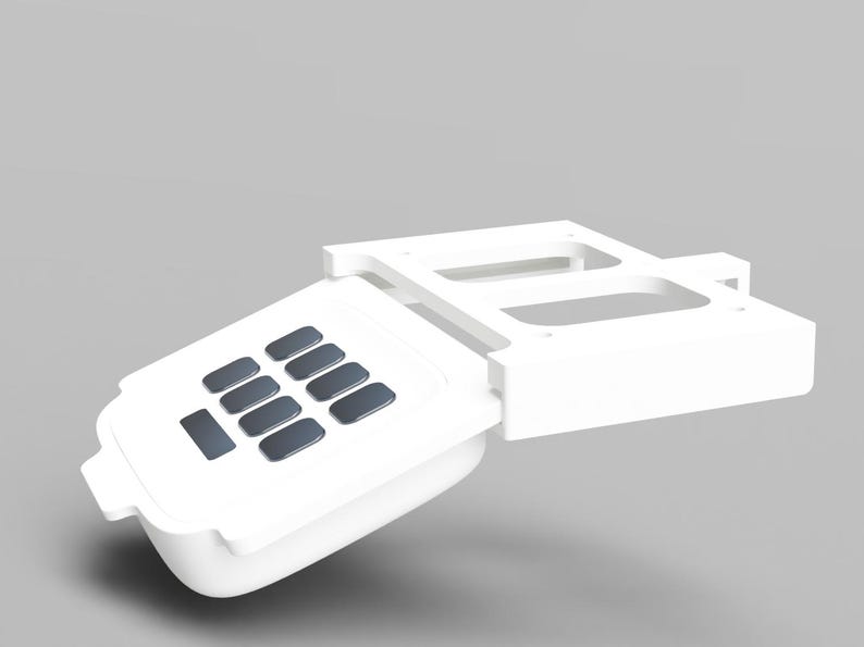 May include: White plastic keypad with a number pad and a long rectangular button. The keypad is attached to a white plastic base with two rectangular openings.
